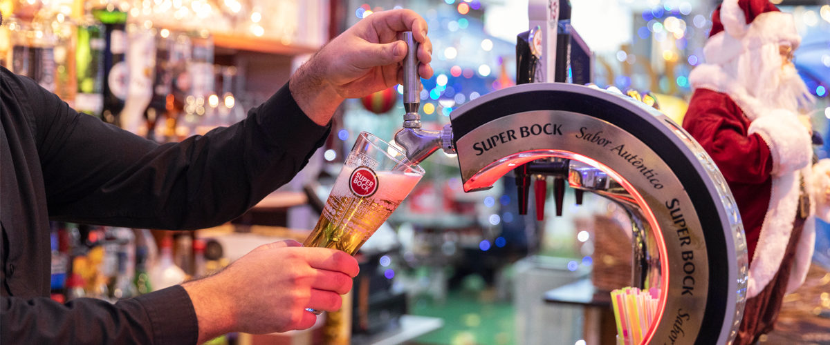 Employee serving a beer on tap