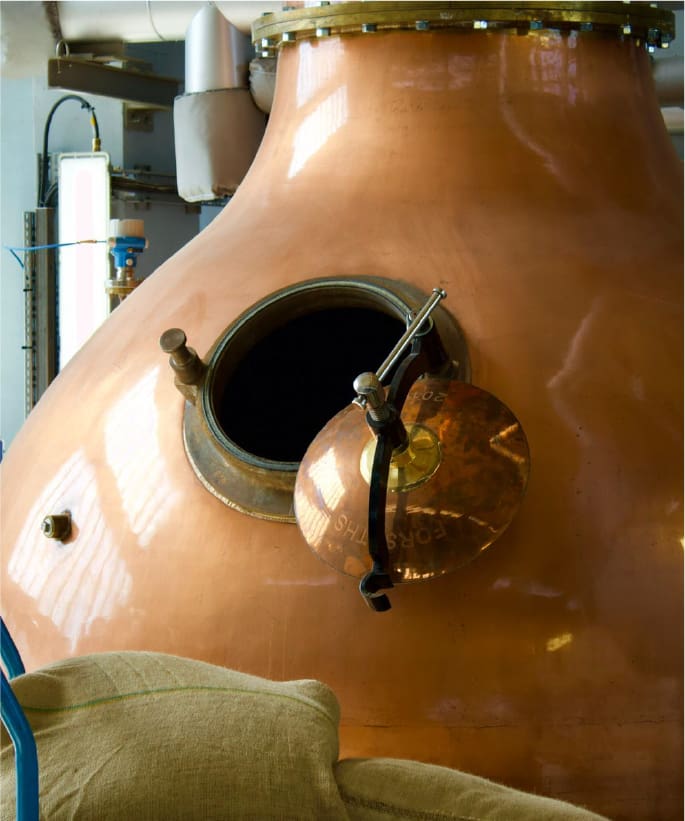 close up of gin distilling pot Beefeater distillery